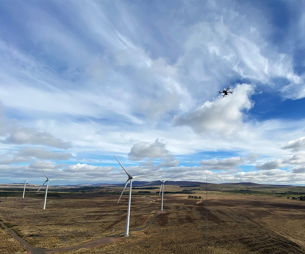 drone flying in windfarm