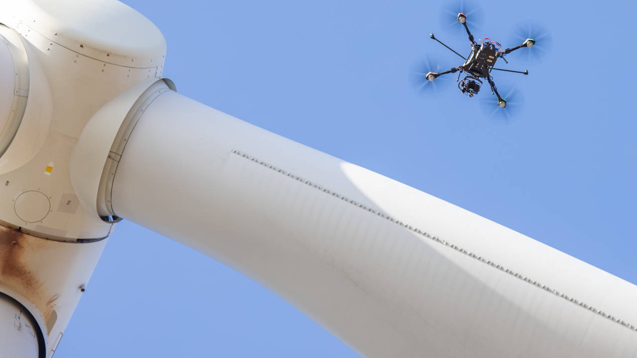 drone next to wind turbine