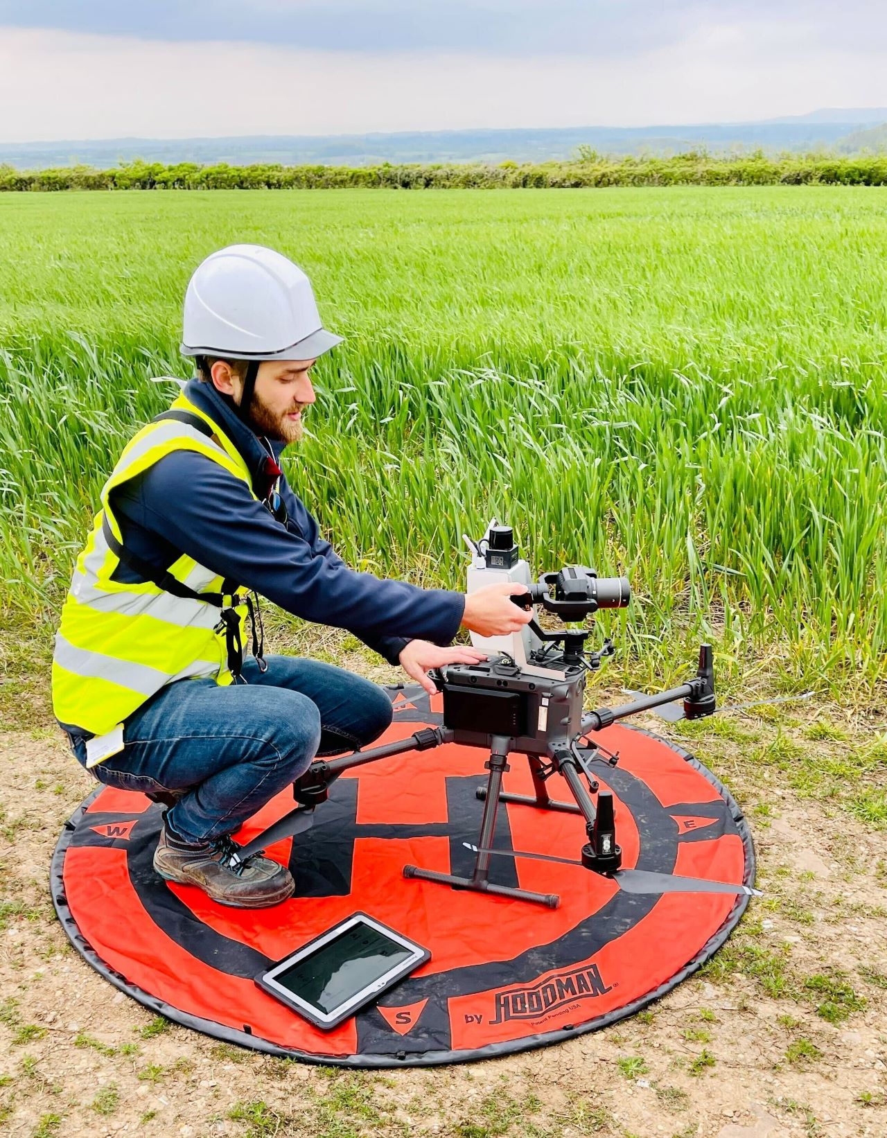 This is a photo of Ben positioning our drone before deployment. 