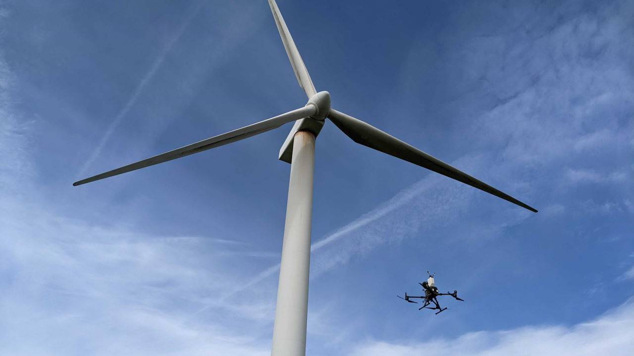 This is an image of one our drones carrying out an inspection on a wind turbine.