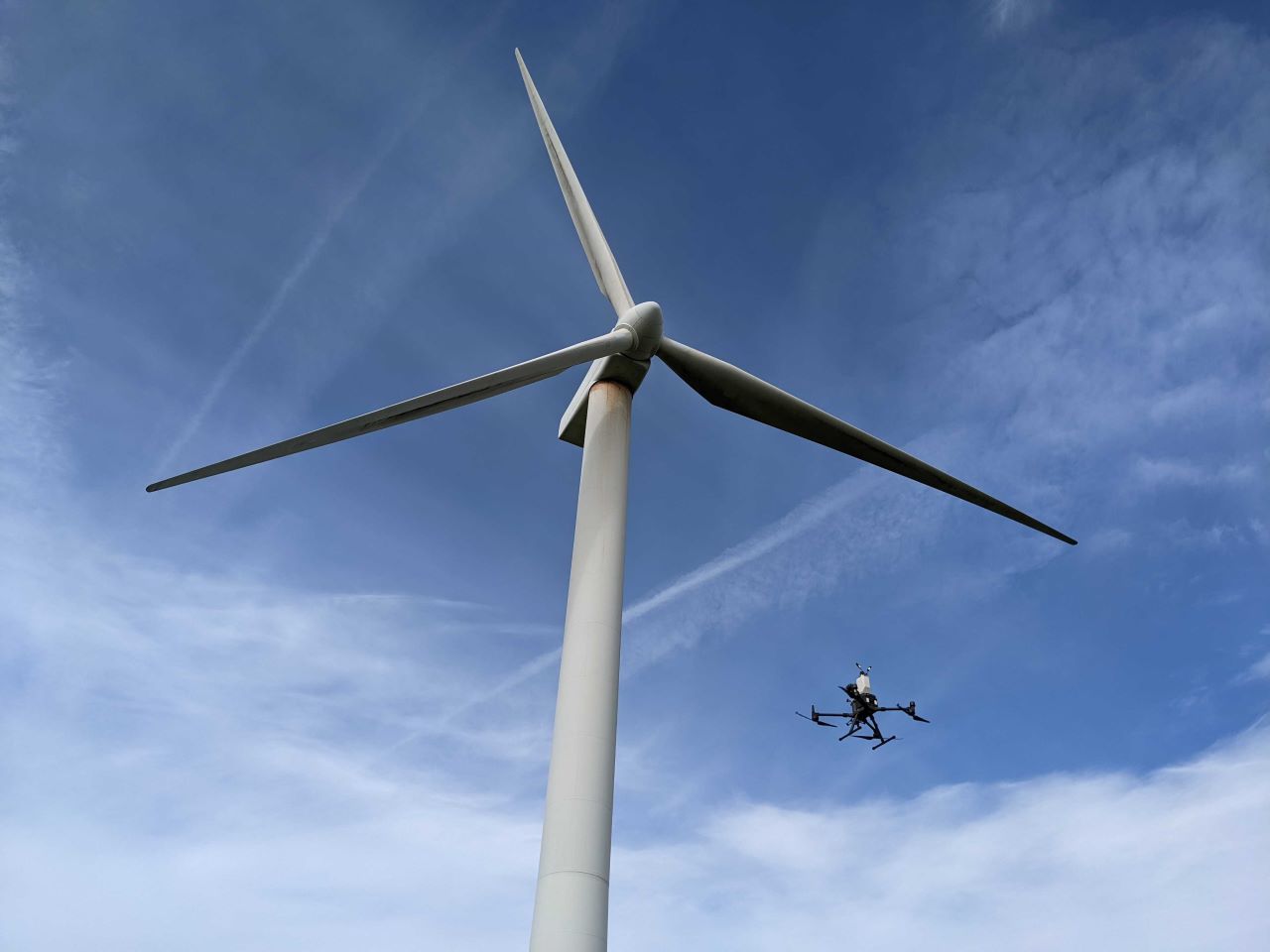 This is an image of one our drones carrying out an inspection on a wind turbine.