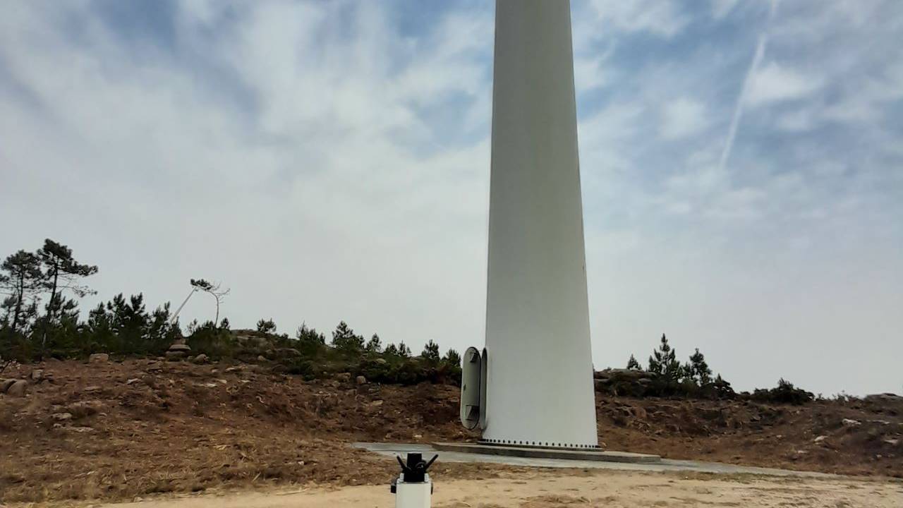 This is a photo of our Dhalion system on the ground in front of a wind turbine.
