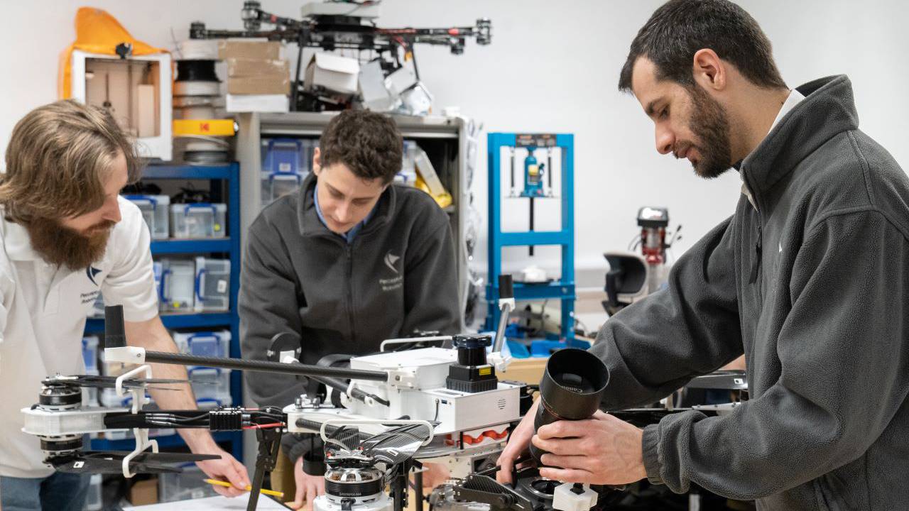 This is an image of the team working on one of the drones in the office.