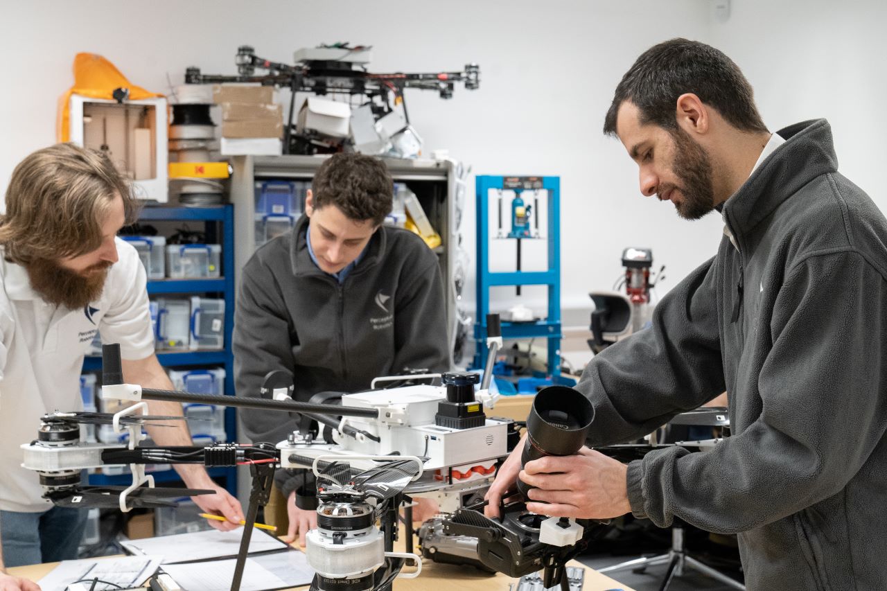 This is an image of the team working on one of the drones in the office.