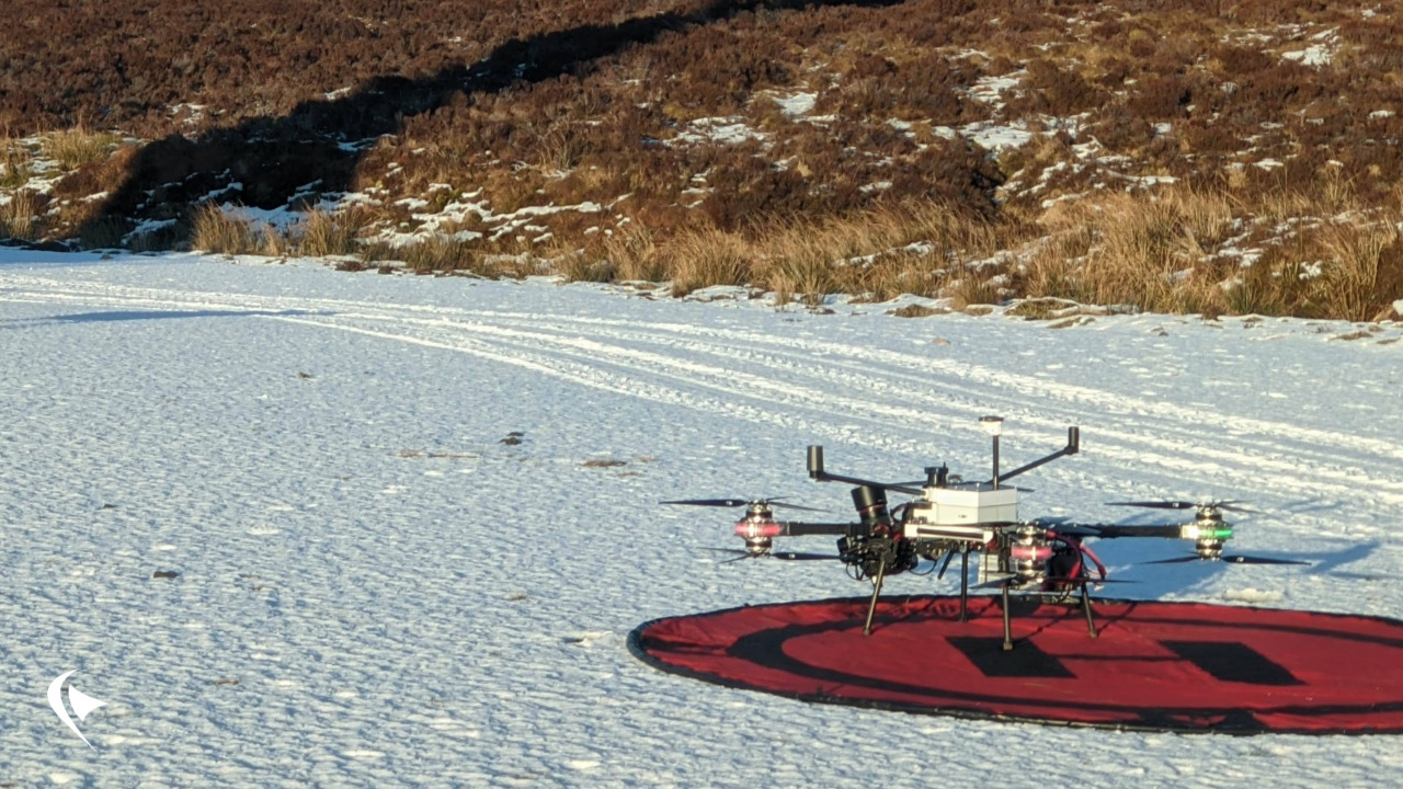 This is an image of our Dhalion drone on a landing pad. The ground is covered in snow.